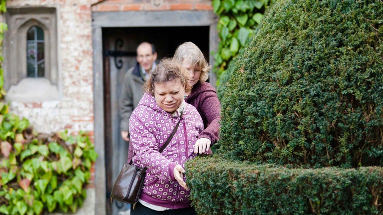Visitors in the Courtyard at Baddesley Clinton, Warwickshire